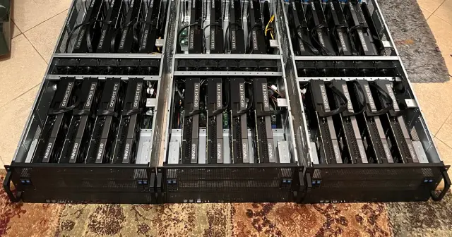 Three 4U GPU servers with eight RTX cards each during assembly