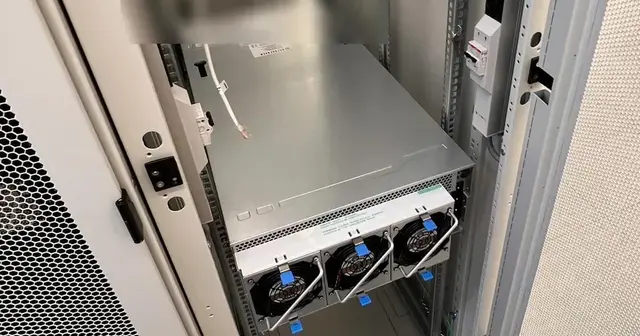 Rear of the racked AURA 4U-G8E2 showing its redundant power supply modules